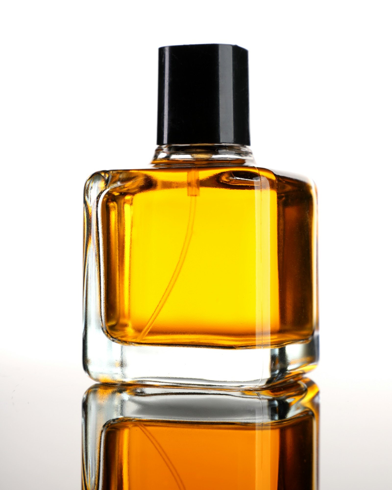 Unbranded amber eau de parfum bottle with a black cap